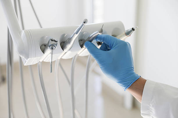 Professional Tooth Extraction technician working in Sidney, IL